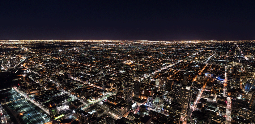 skyline view of city roads at night to depict what's driving microwork