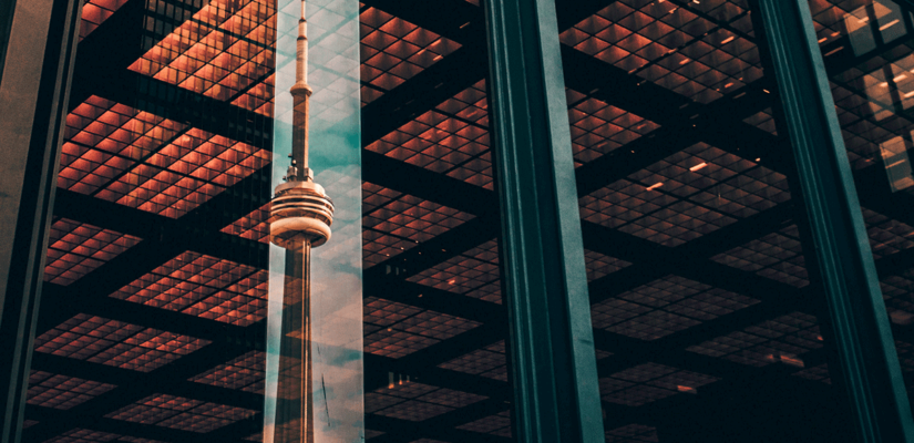 CN tower reflected in highrise window